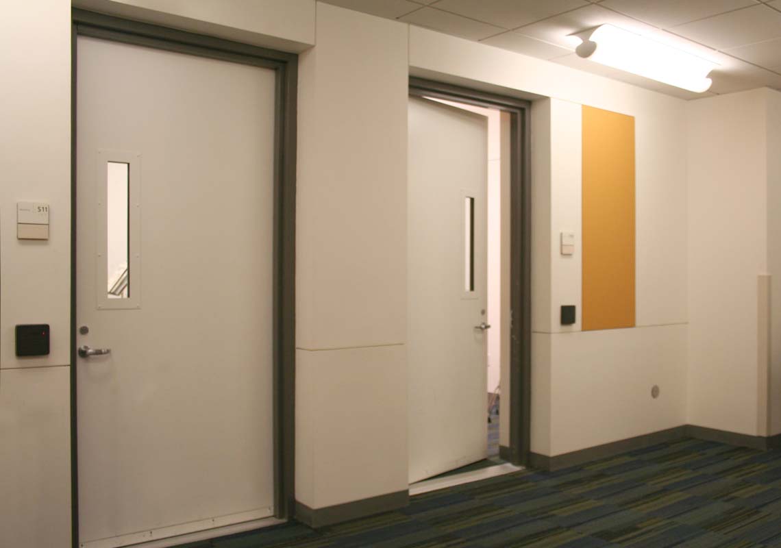 Acoustical classroom doors with vision lites.