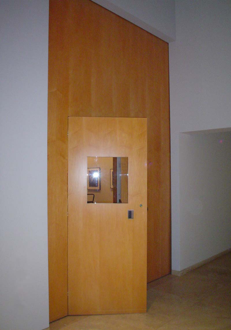 Pocket door with a wicket door.